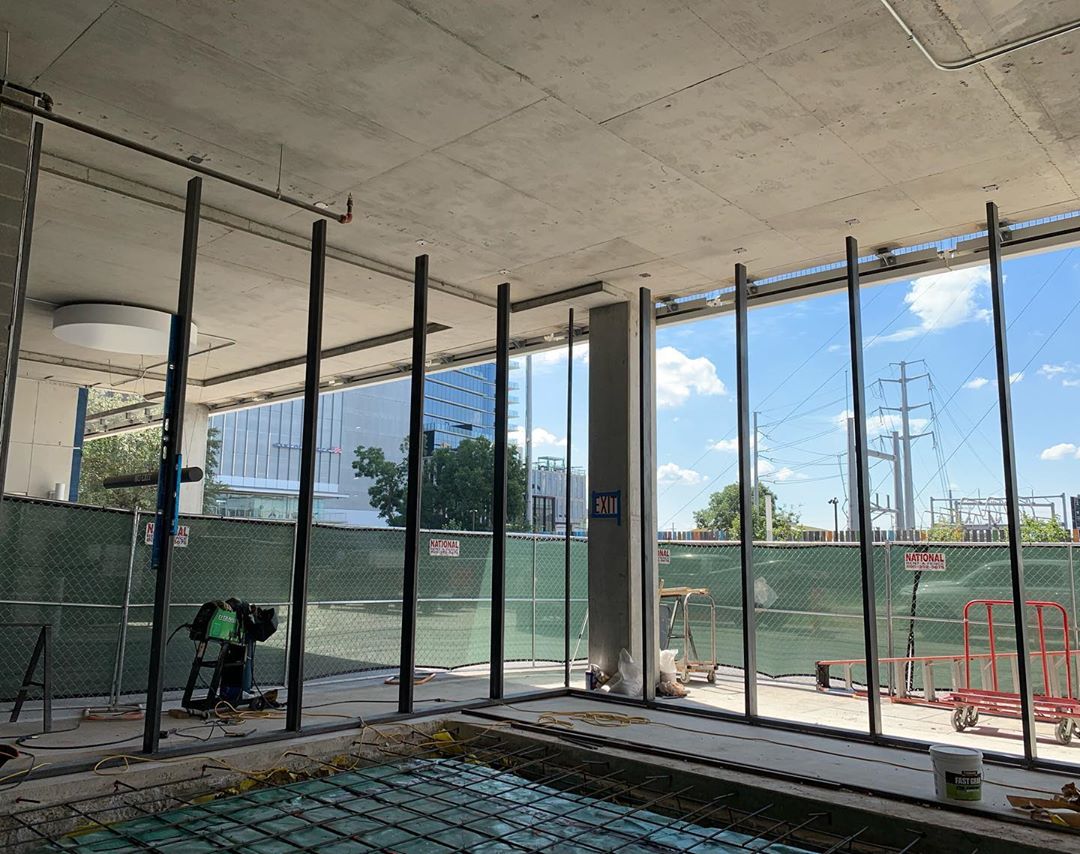 Bespoke design steel window frame system by @michaelryandickson for @urbanspacerealtors at @theindependentaustin This space is available for restaurant lease!